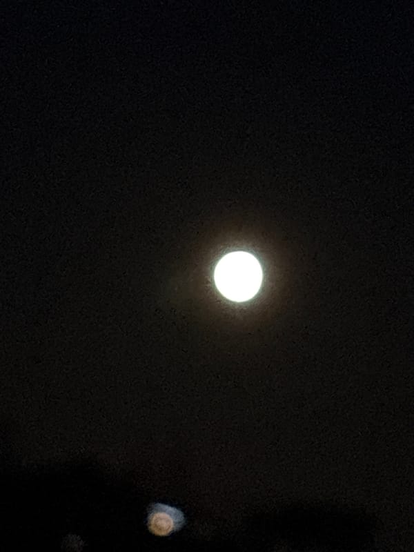 Bright moon observed in night sky over Chaykovsky, Russia