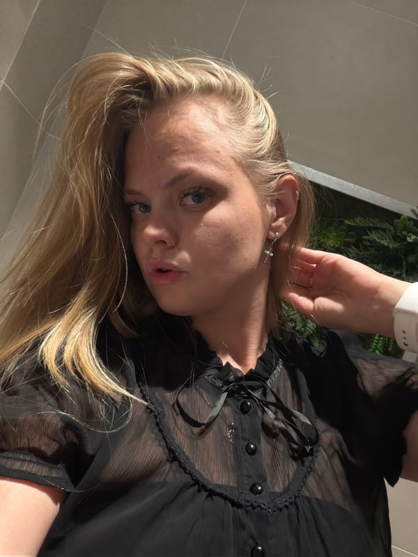 Outfit selfie session in an Izhevsk public restroom