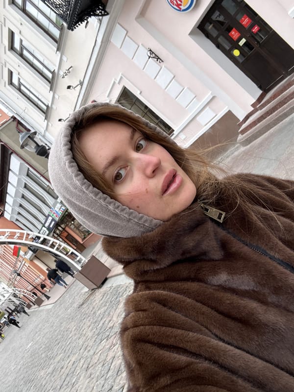 Woman takes selfie on historic pedestrian street in Hrodna