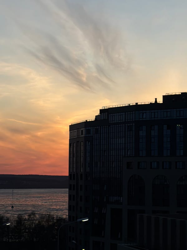 Evening scenes captured in Izhevsk showing high-rise, cathedral