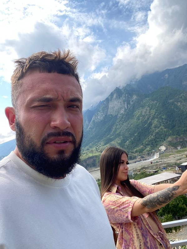 Selfies and downtime against a Caucasus mountain backdrop