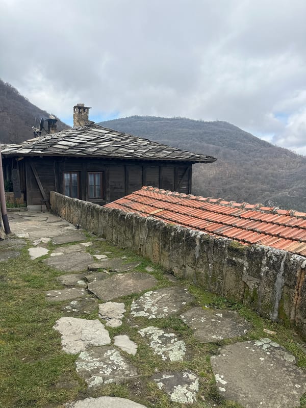 Traditional village architecture and mountain views documented in Glozhene