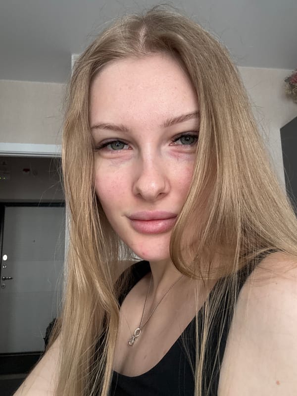 Woman takes selfies in kitchen in Perm, Russia