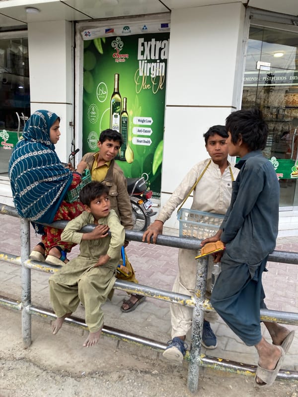 Family group interacts with metal structure in Quetta
