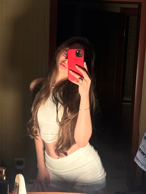 Woman Takes Mirror Selfies in Krasnodar Bedroom