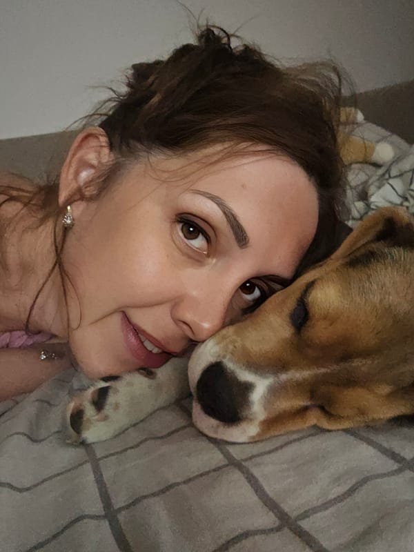 Woman shares quiet afternoon moments cuddling with pet dog