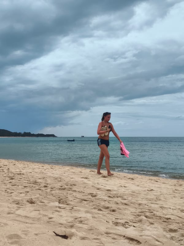 Barefoot beach walk on a cloudy Ko Samui morning