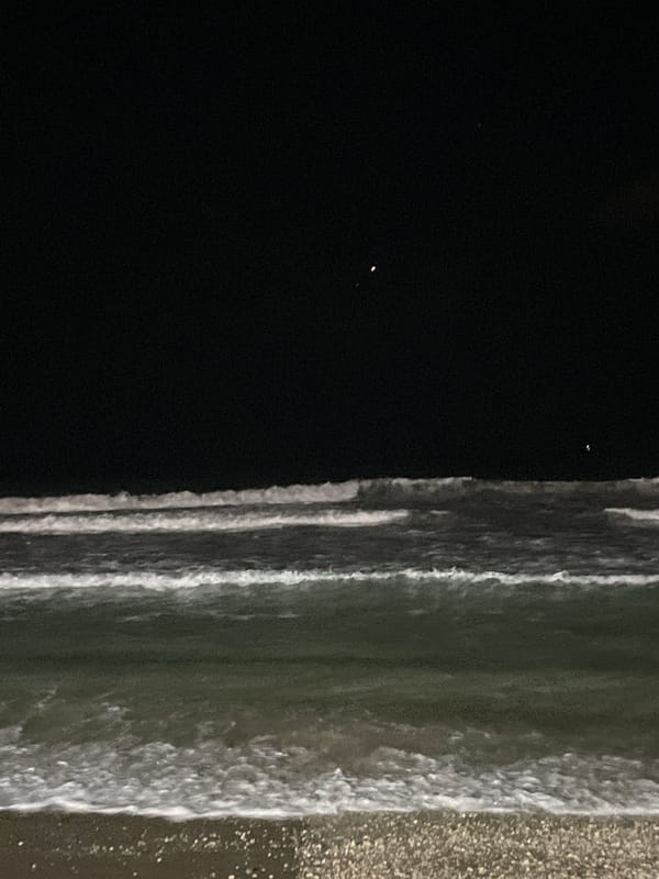 Night at the Herzliya beachfront, waves and promenade