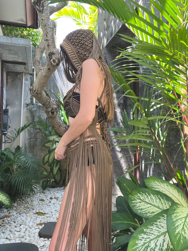 Woman photographed in macrame dress at North Kuta resort
