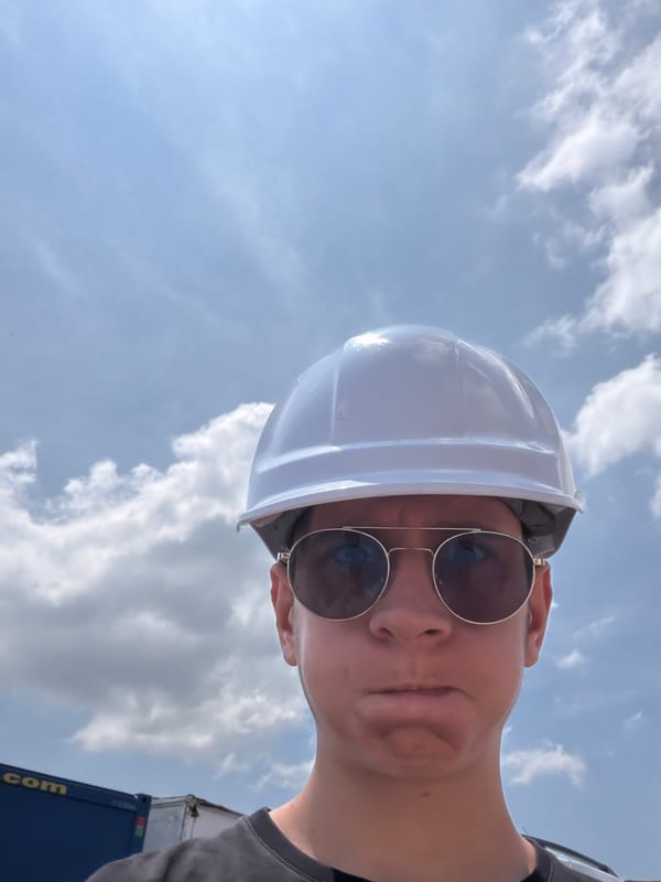 Hard hat selfie against a cloudy sky in Lozen, Bulgaria