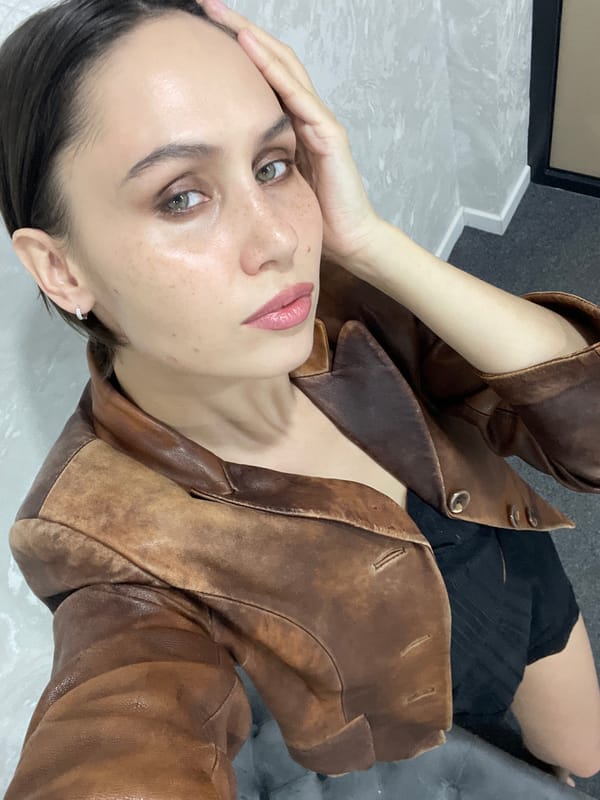 Woman photographed in leather jacket, two poses, Izhevsk