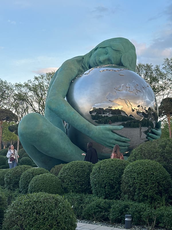 Tourist takes selfie at globe sculpture in Krasnodar park