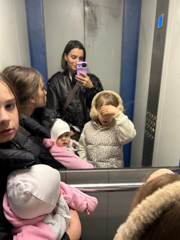 Woman takes selfie with children in Moscow transit