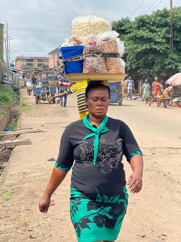 Street vendors and transport workers documented during morning commerce