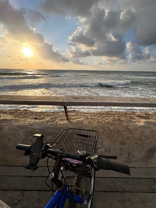 Coastal sunset scene with bicycle captured in Tel Aviv