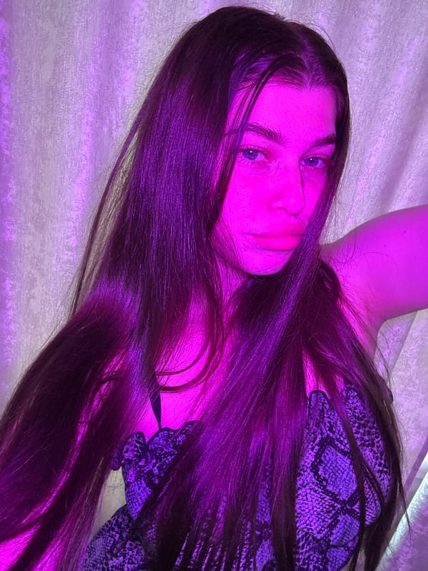 Woman in snake-print photographed under purple lighting in Мещёры