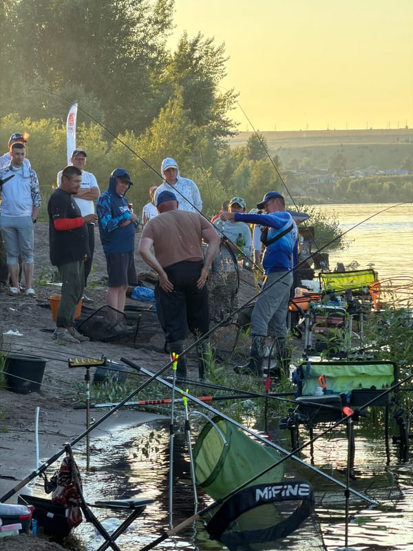 Riverside fishing gathering near Tarasovo at golden hour