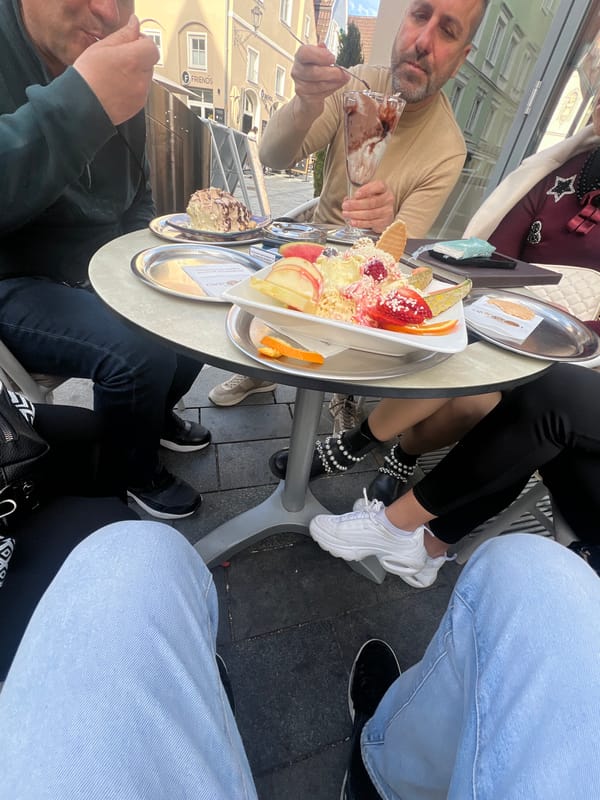 Outdoor cafe diners enjoy ice cream in Memmingen