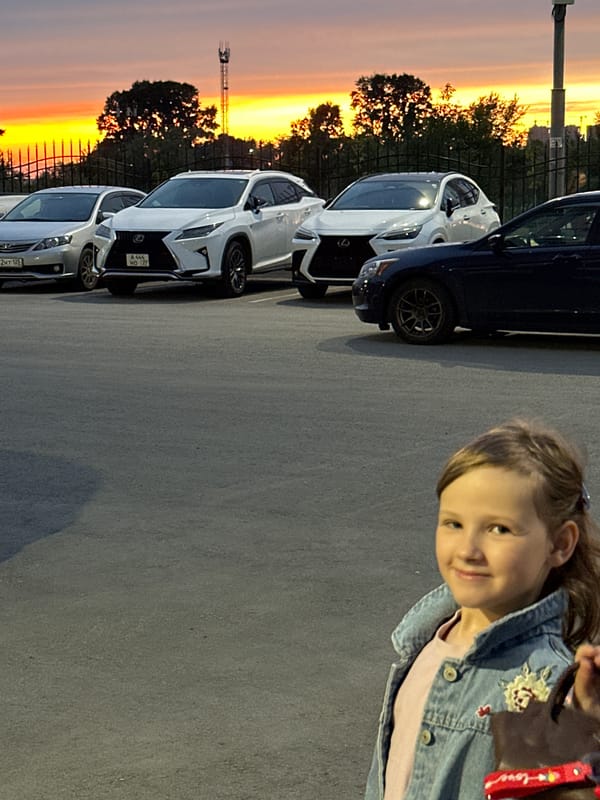 Girl and cars photographed during stunning Khabarovsk sunset