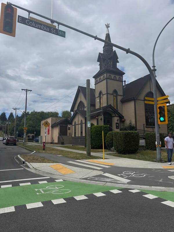 Church and traffic light at a New Westminster street corner