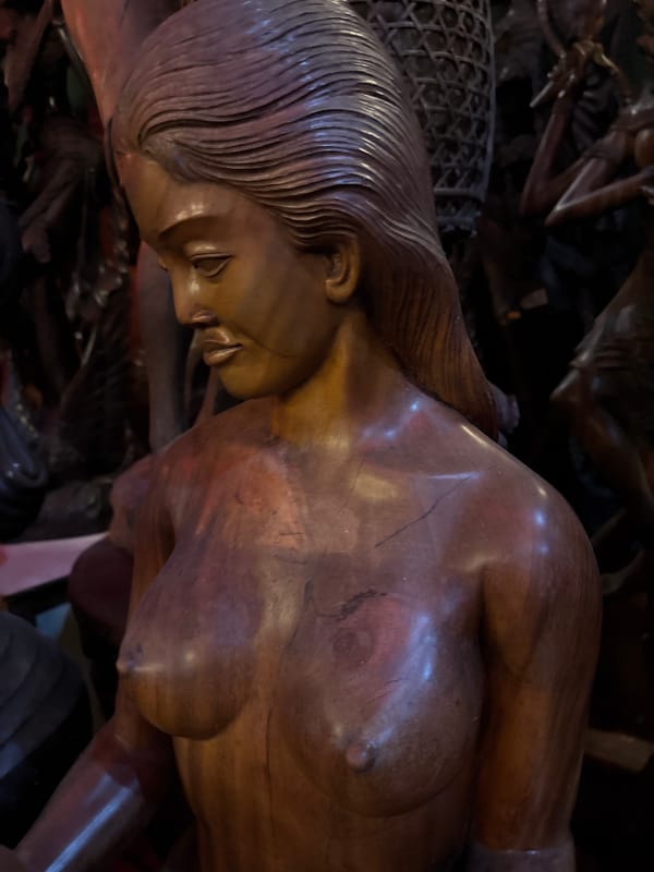 Browsing Balinese wood carvings and sculptures in Kuta