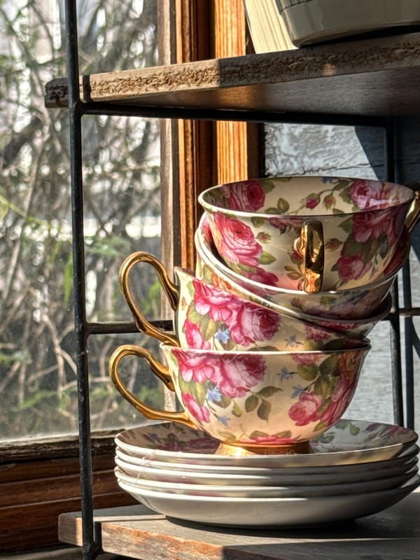 Floral teacups stacked on a shelf in Lobacheve