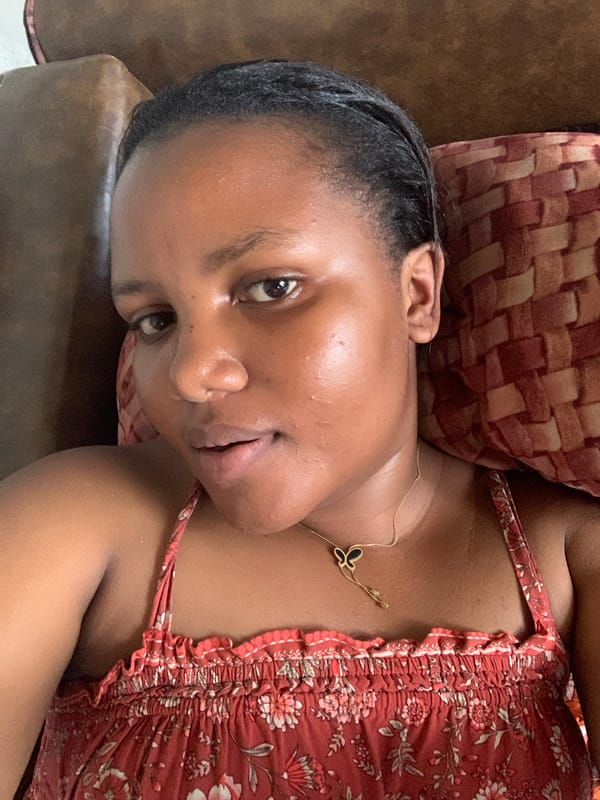 Woman rests on couch in Dar es Salaam morning