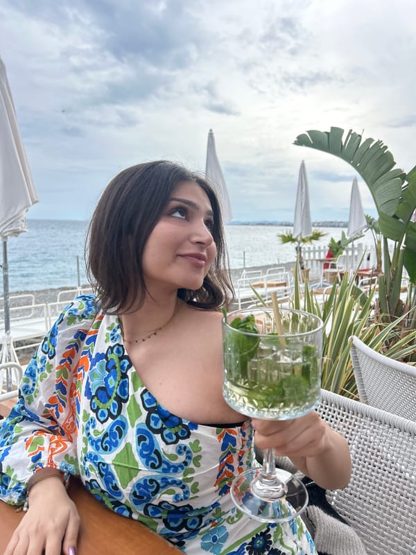 Cloudy afternoon captures cafe moment and beach scene in Nice