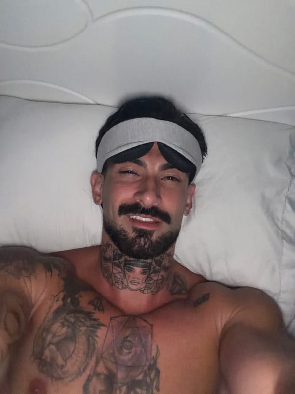 Man rests with sleep mask in Chalong bedroom
