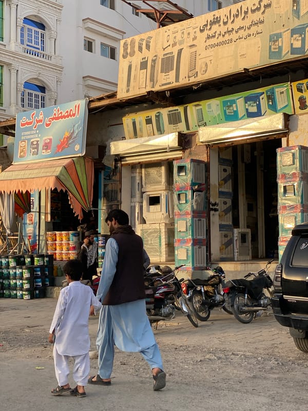 Air coolers stacked for sale on a Kandahar street