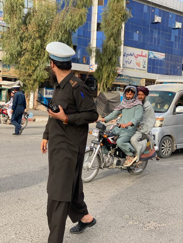 Traffic officer directs intersection in Kandahar, Afghanistan