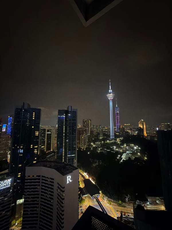 Kuala Lumpur skyline, luxury car, and hotel interiors