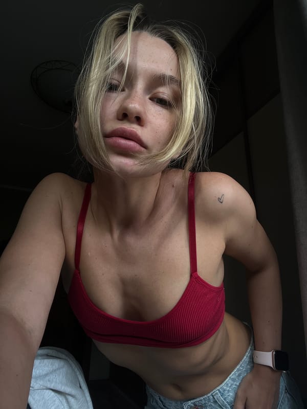 Woman takes selfies in Voronezh building during afternoon