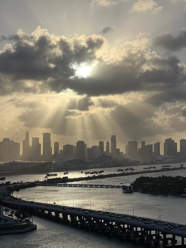 Woman takes selfie on bench press at Miami Beach gym