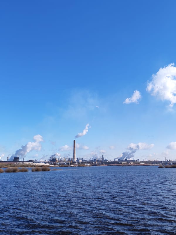 Tugboat operations documented near industrial waterfront facility