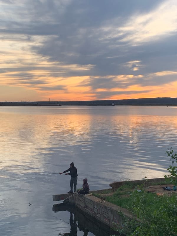Leisure activities observed at Chaikovsky waterfront during sunset
