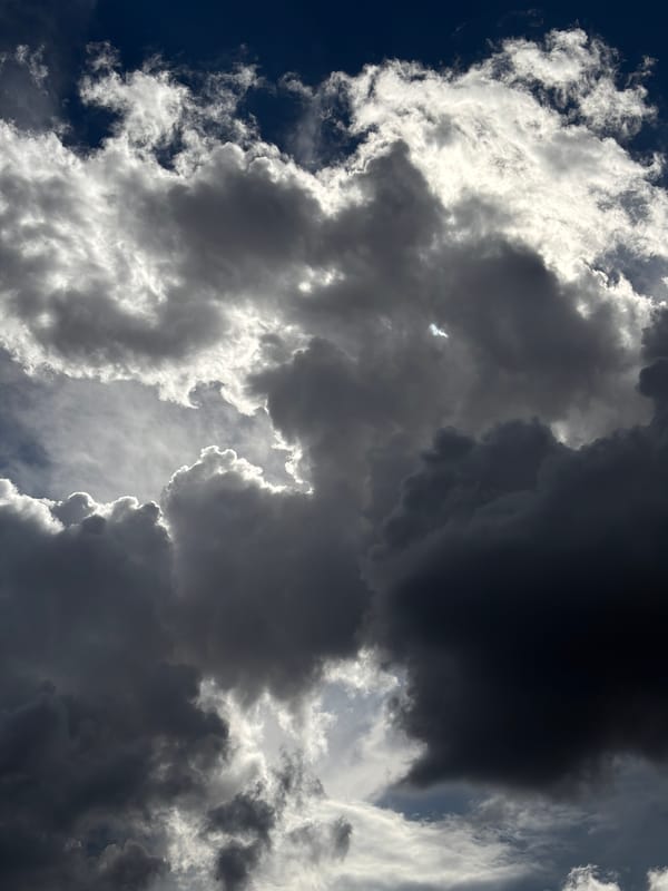 Storm clouds gather over city as dramatic weather develops
