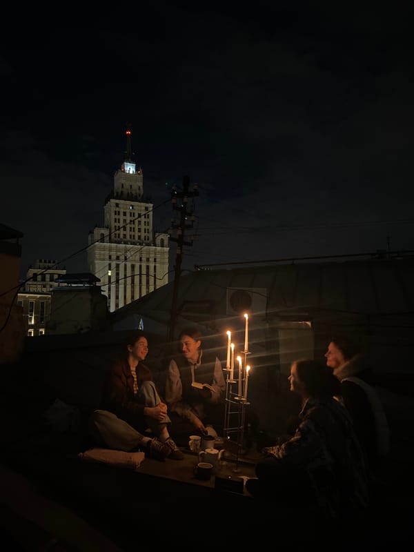 Friends gather for candlelit rooftop evening in Moscow