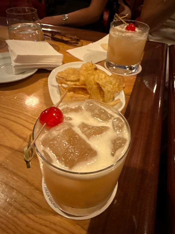 Cocktails and chips documented at Madrid dining scene