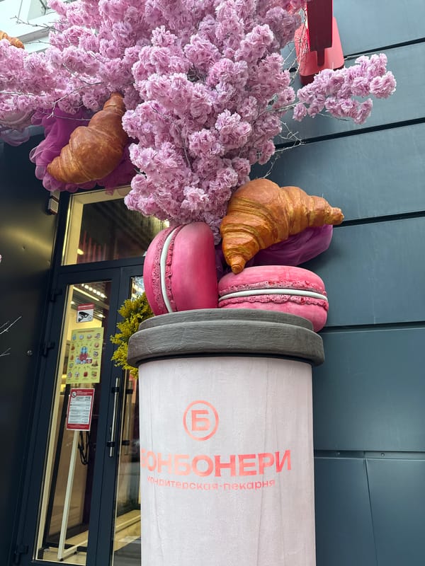 Everyday moments captured in Belgorod: bakery display, woman with phone
