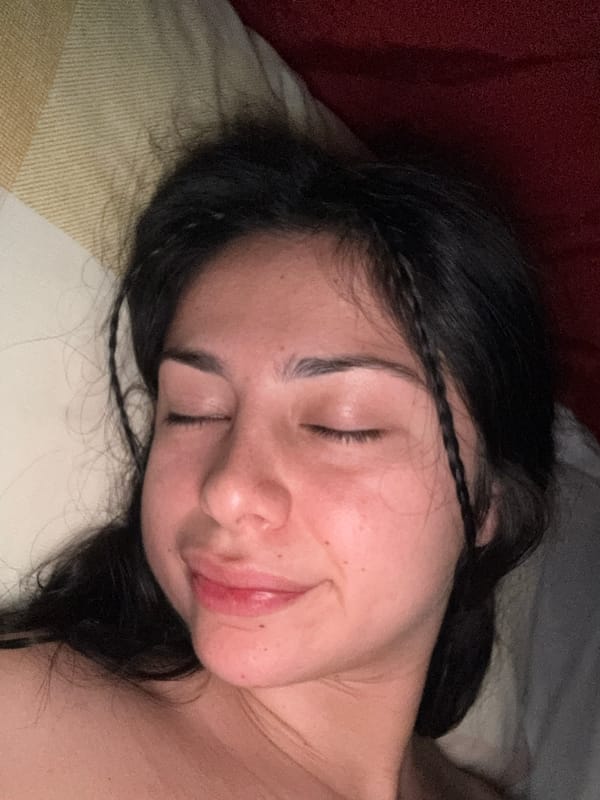 Woman observed sleeping on striped pillow in Como residence