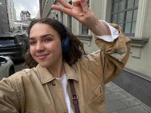 Young woman takes street selfies in Moscow's Zamoskvorechye district