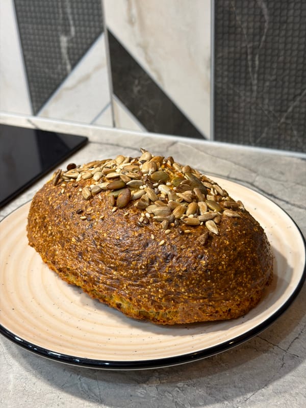 Home baker documents fresh seeded bread preparation in Ryazan