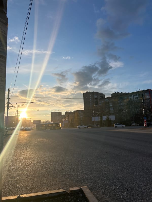 Golden hour sunset illuminates Izhevsk street scene