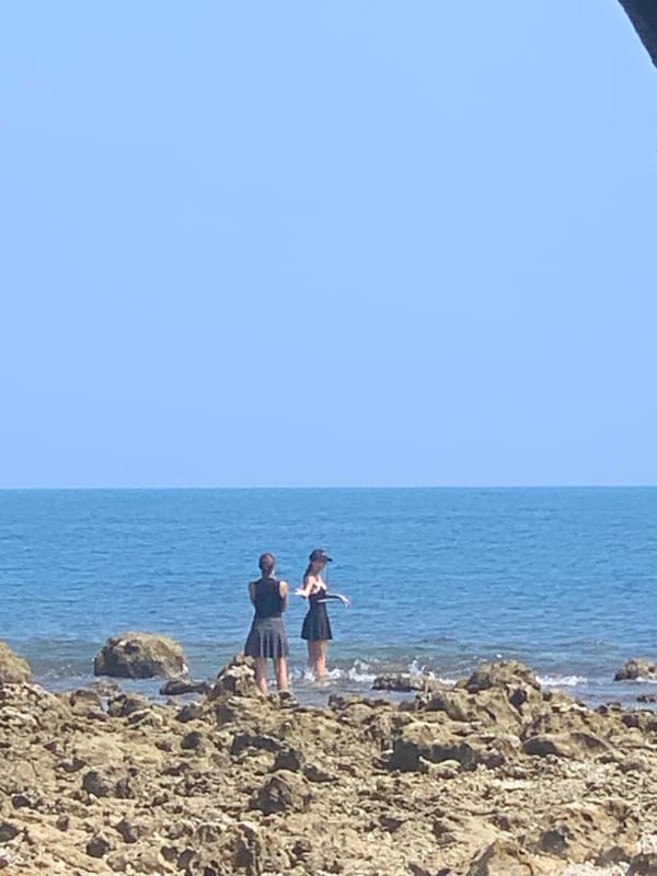 Visitors gather at serpent statue on Ko Samui coast