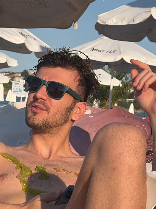 Relaxing at the beach, seaweed in hair, sunny afternoon