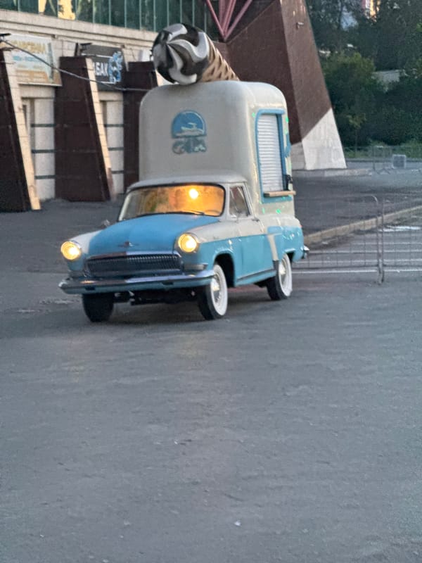Evening scenes across Yekaterinburg streets, trucks, and apartment blocks