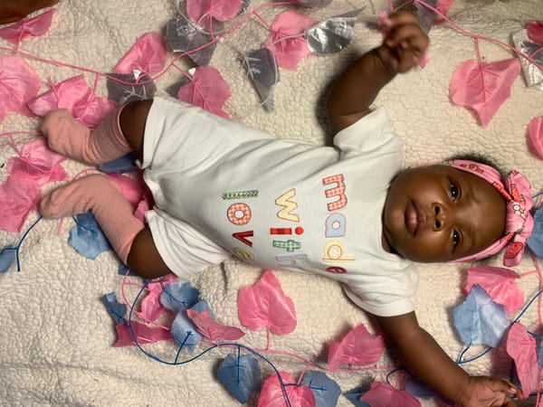 Baby photographed on blanket in Rafin Bauna, Nigeria