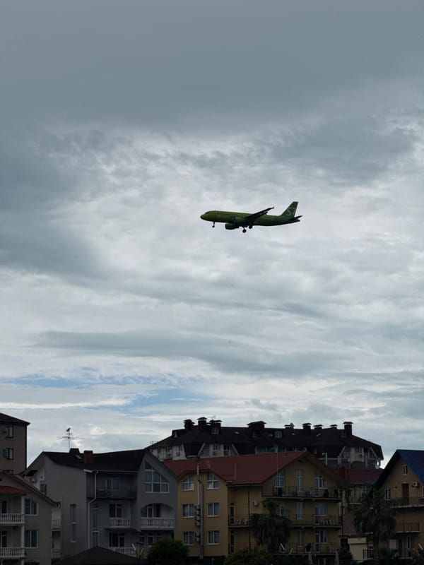 S7 Airlines flight observed over overcast Sochi during morning