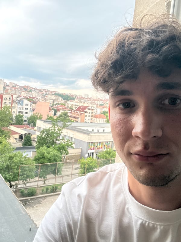 Young man photographed against city backdrop in Haskovo, Bulgaria